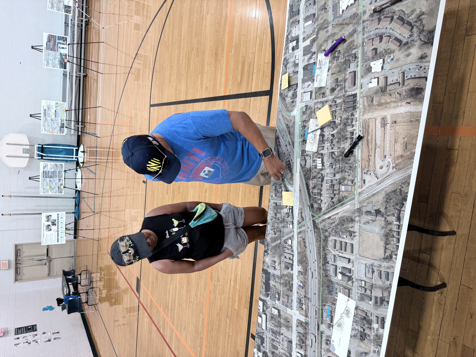 Community members reviewing a large project map