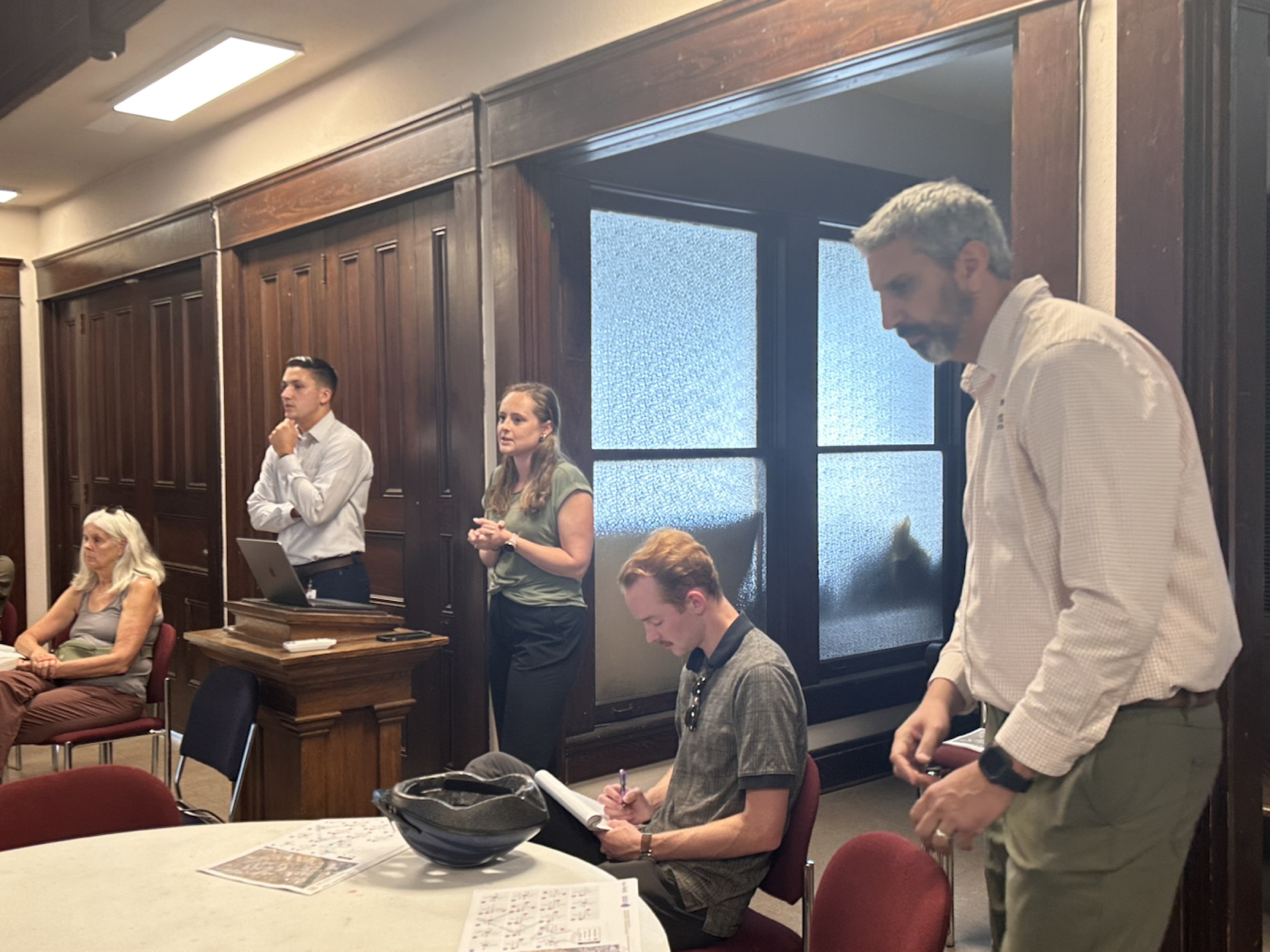 Project staff facilitate an East Nashville Spokes open house around neighborhood maps and activity tables.