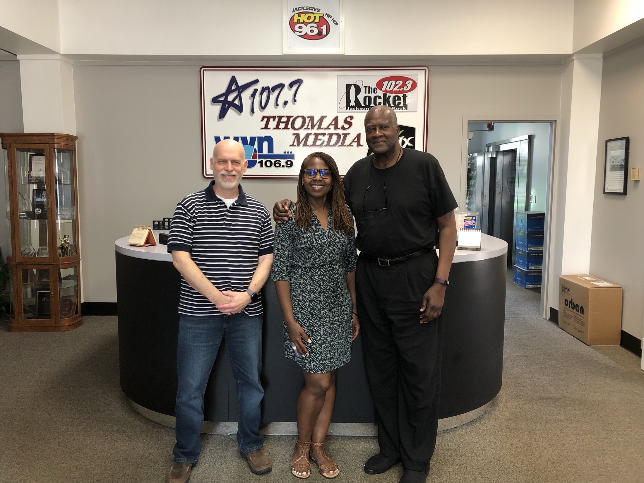 Fairpointe staff and local partners visit a Jackson radio station for community outreach.